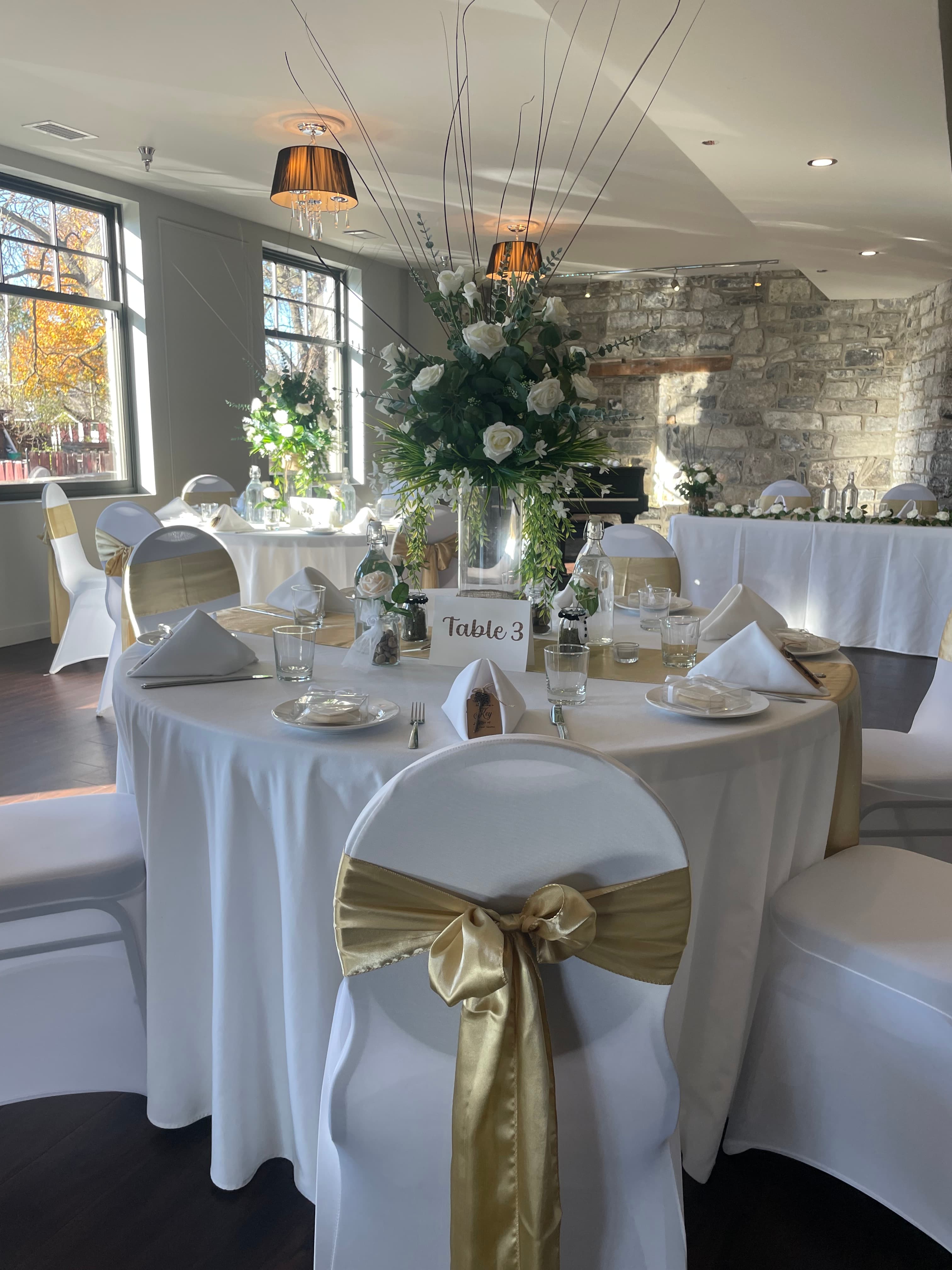The Gold Room set with round tables for a reception